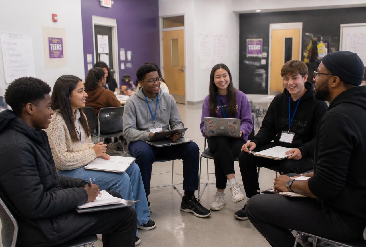 Young people smiling during a GROUNDWORK workshop with a mentor
